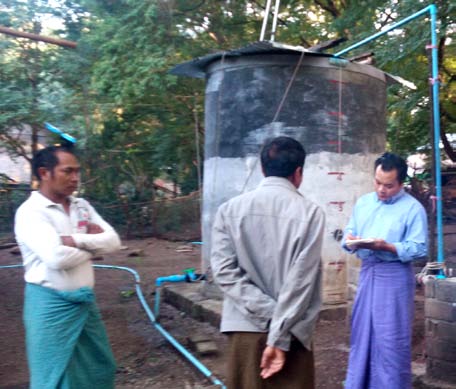 Fig. 6: Interview with the Owner of DG3 c) Diesel Mini-Grids That village is currently powered by three selfreliant Diesel Mini-Grids: DG1 (10 kW), DG2 (15 kW), and DG3 (15 kW) to 3 clusters; each has about 100 households. 3 Pagodas, 3 Monasteries and street lightings are also supplied by DG3. The single-phase, Synchronous type, 4-pole, 1500 rpm, 50 Hz low-cost Generators are operated with belt-drives from the Diesel engines. The capacities are engine 22 HP (horsepower) with 10 kW Generator and engine 25 HP with 15 kW Generators. Their service years are: DG1 is ten years; DG2 and DG3 are five years. It found that another Diesel system (22 HP Diesel engine with 10 kW Generator) for water pumping at the DG2 site as identified in Fig. 7.
