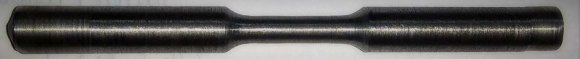 Fig. 1: (a). EN36C Steel mounted on the lathe. (b). EN36C Steel after machining.